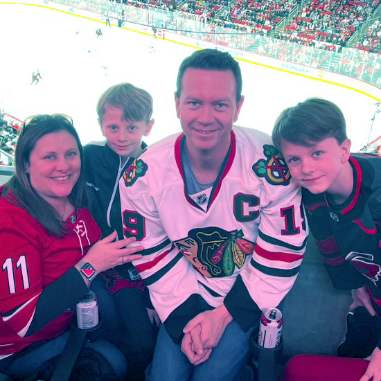 Dave, Shannon, Austin and Carter at a hockey game.